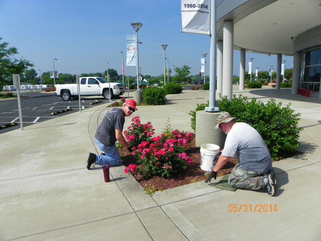 John Glover & John Hoopes help clean up flower beds too